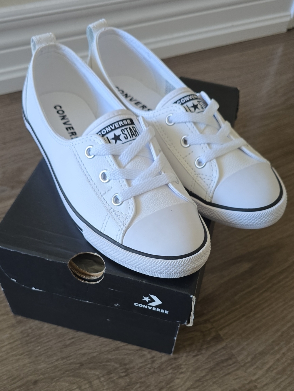 Converse White Low-Top Slip On Sneakers with Black Trim